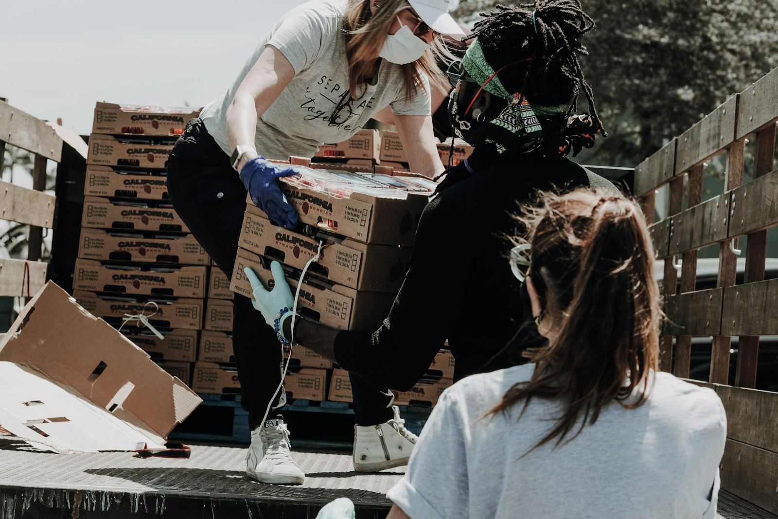 Volunteers preparing supplies for families in the community